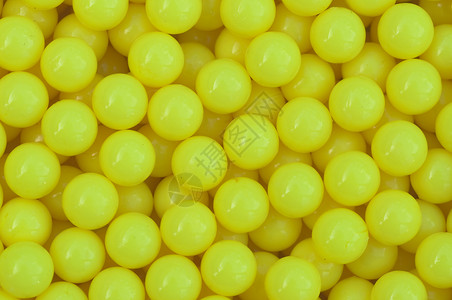 黄黄色塑料背景水平爱好宏观包装材料纺织品墙纸圆形黄色按钮背景图片