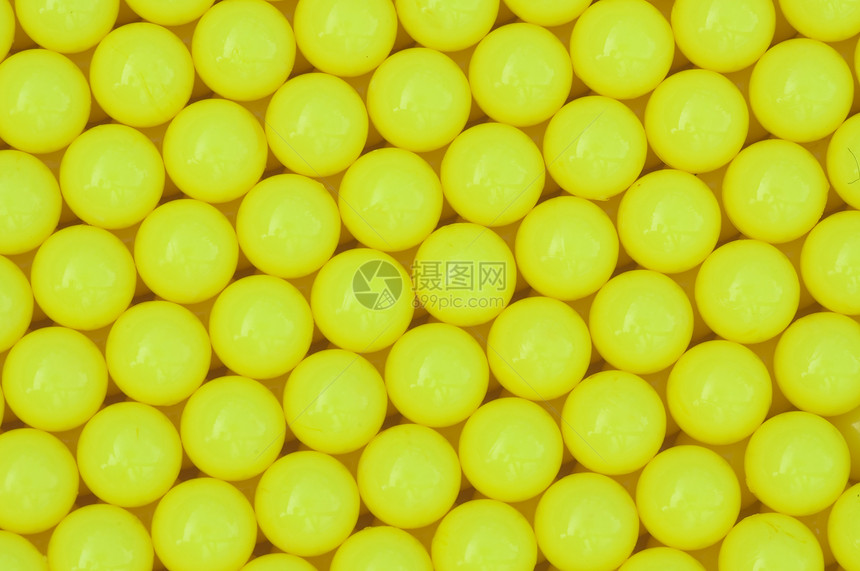 黄黄色塑料背景黄色包装宏观水平墙纸圆形材料爱好按钮纺织品图片