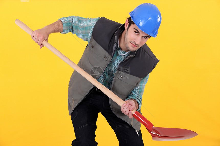 商务人士拿着铲子零售商工作衣领建设者安全帽男人黄色商务安全劳动者图片