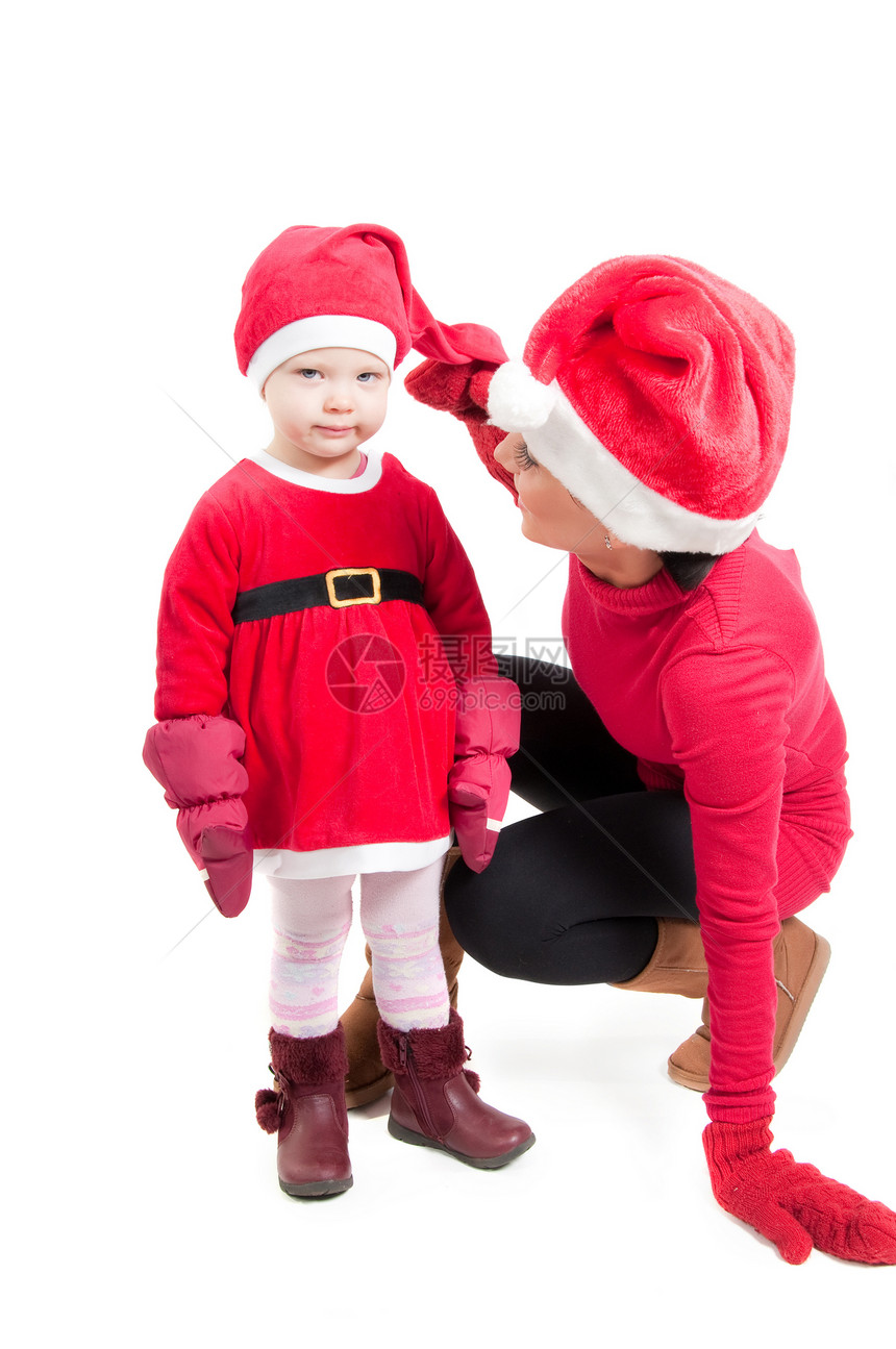 圣诞老人母亲和女儿在工作室微笑帽子宝贝金发女孩婴儿红色女士孩子成人图片