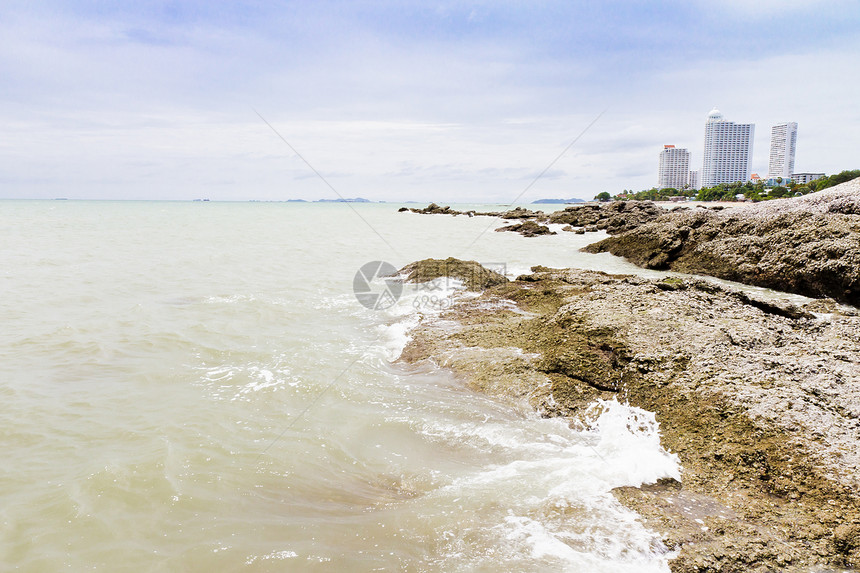 海滩 岩石地区和海洋日落场景天空石头地平线海景荒野蓝色海岸日出图片