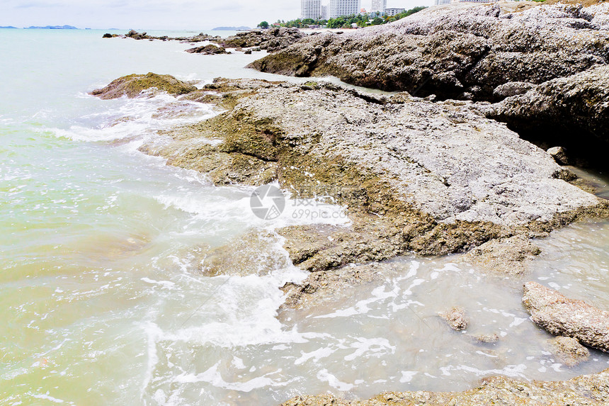 海滩 岩石地区和海洋地平线海浪阳光野生动物风景旅行荒野场景正方形太阳图片