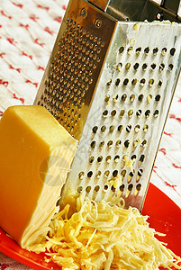 烤奶酪金属烹饪用具桌布盘子厨房奶制品美食品味营养高清图片