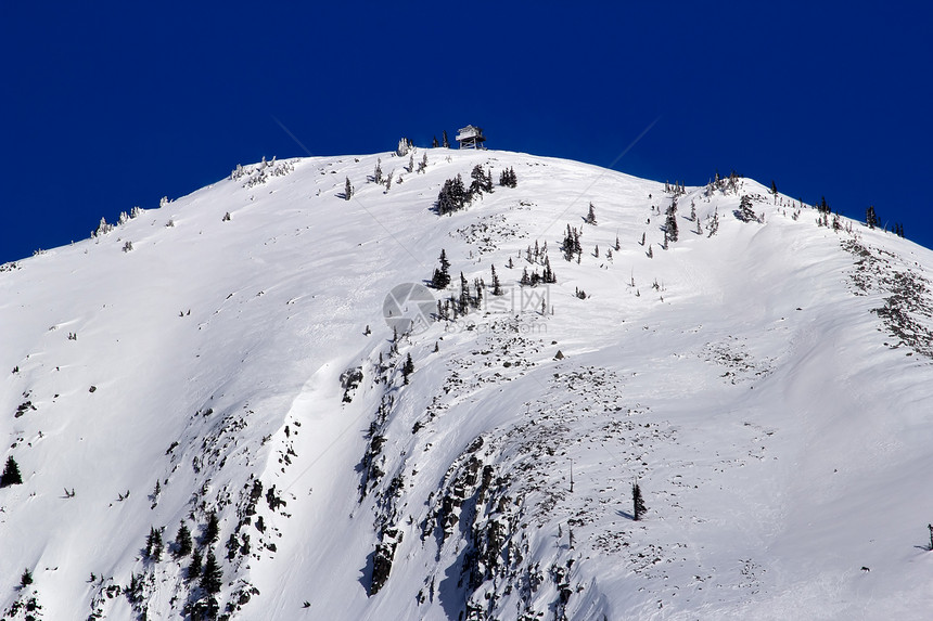 从望塔Snoqualme下雪雪花岗岩山图片