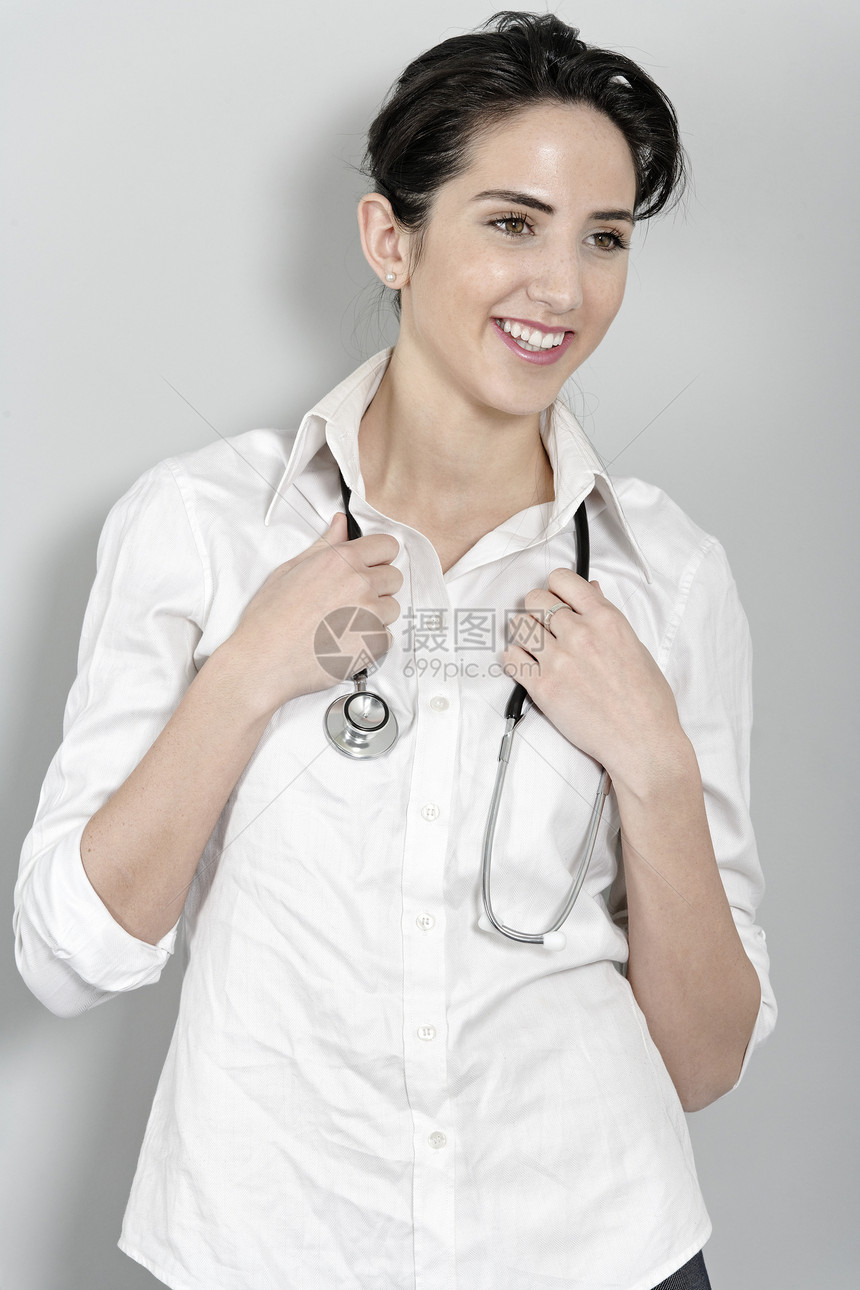配备听诊器的女医生医师诊断桌子学校护士从业者咨询女士快乐女性图片