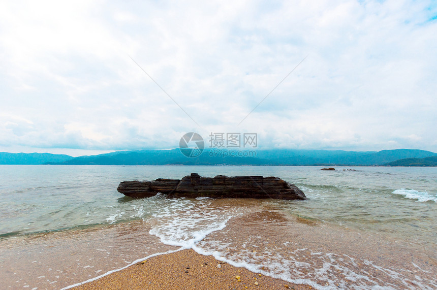 海洋的海岸旅行海滩石头流动阳光日出假期风景海景蓝色图片