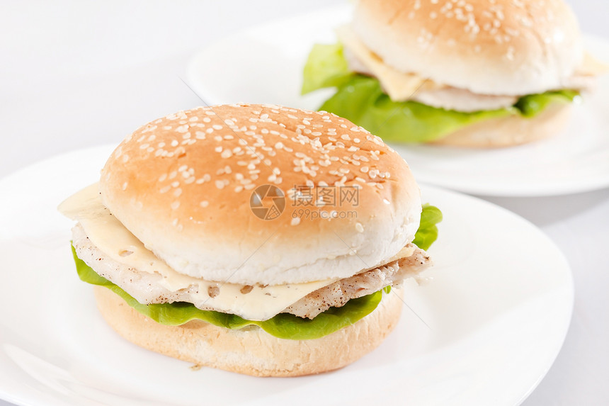 鸡肉三明治洋葱包子盘子食物芝麻小吃面包派对图片
