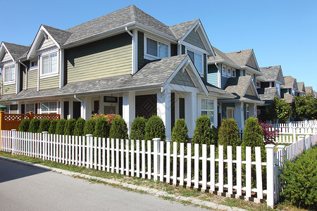 在加拿大里士满的住宅阳光白色治文城市城市化均匀性邻里居住植物栅栏背景图片