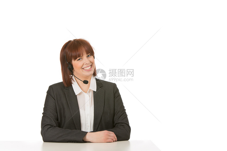 戴头盔的笑女人工人办公室商业就业帮助操作员耳机呼叫桌子接待员图片