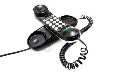 一个带按钮的黑色手机电缆白色会议电话固定电话反射商业塑料技术讨论背景图片