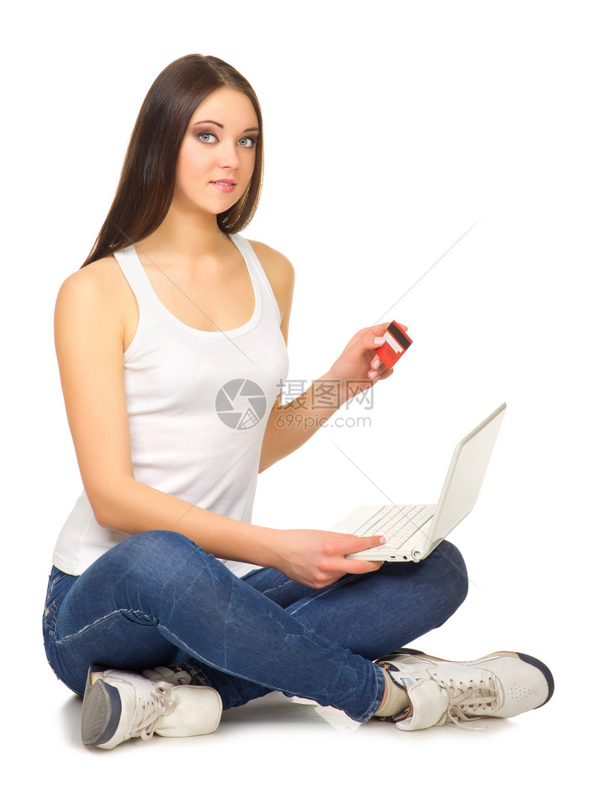 拥有笔记本电脑和信用卡的年轻女孩技术金融电子商务商业头发闲暇购物女性互联网网络图片