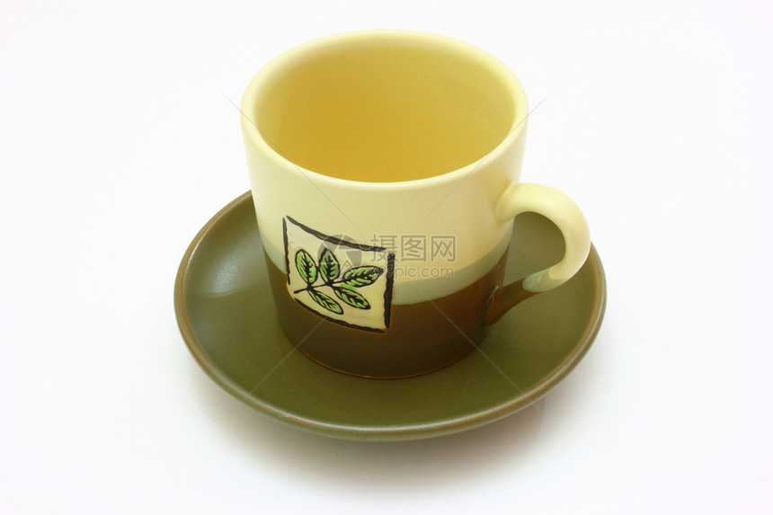 茶碟上的陶瓷杯谷物早餐桌子厨房食品杯子陶器飞碟饮料餐具图片