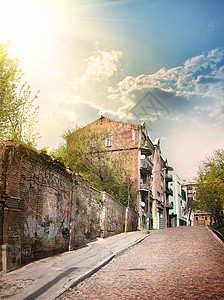 涂鸦太阳素材旧式房子旅行鹅卵石目的地路灯城市石头天空外观建筑结构背景