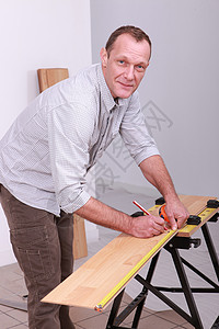 木匠的标识木材安装角落建造木头划痕男人劳动铅笔统治者磁带背景图片