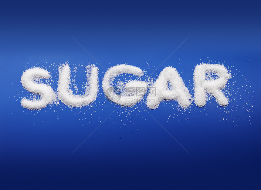 糖蓝色细粒状甜蜜颗粒状字母刻字概念白色图片