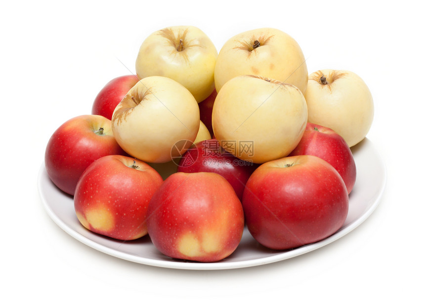 盘子上的红苹果和黄苹果图片