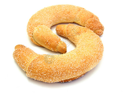 新鲜的羊角面包被糖制成盐盘子食物粉状白色包子脆皮小吃棕色甜点面团背景图片
