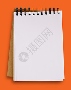 以橙色背景 剪切路径隔离的开放空白笔记本高清图片