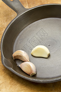 大蒜煎锅烹饪生活方式瓶子素食饮食食物美食家茶点球根摄影背景图片