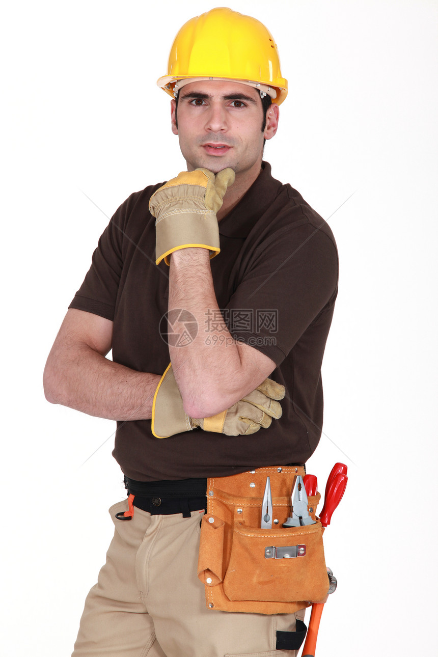 带工具的手工艺人腰带工匠男人手臂手套技术弯曲黄色头盔专业化图片