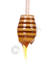 蜂蜜滴滴用具蜂蜜滴水食物棕色金子白色液体黄色宏观背景图片