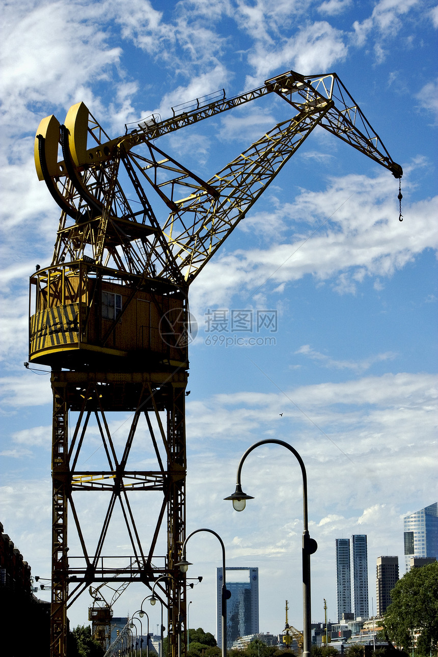 布埃诺斯空气中的起重机团结摩天大楼海浪办公室植物阴影蓝色建造建筑房子图片