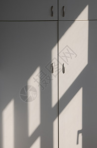 光明和阴影家具衣柜明暗壁橱创造力概念光影案件阳光抽屉柜背景图片