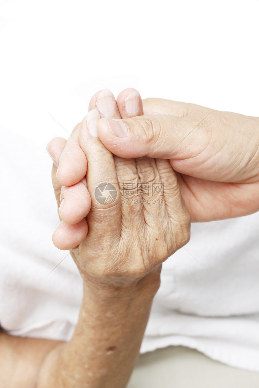 握着一只手女性团结护理皮肤友谊老年家庭概念安慰医院图片