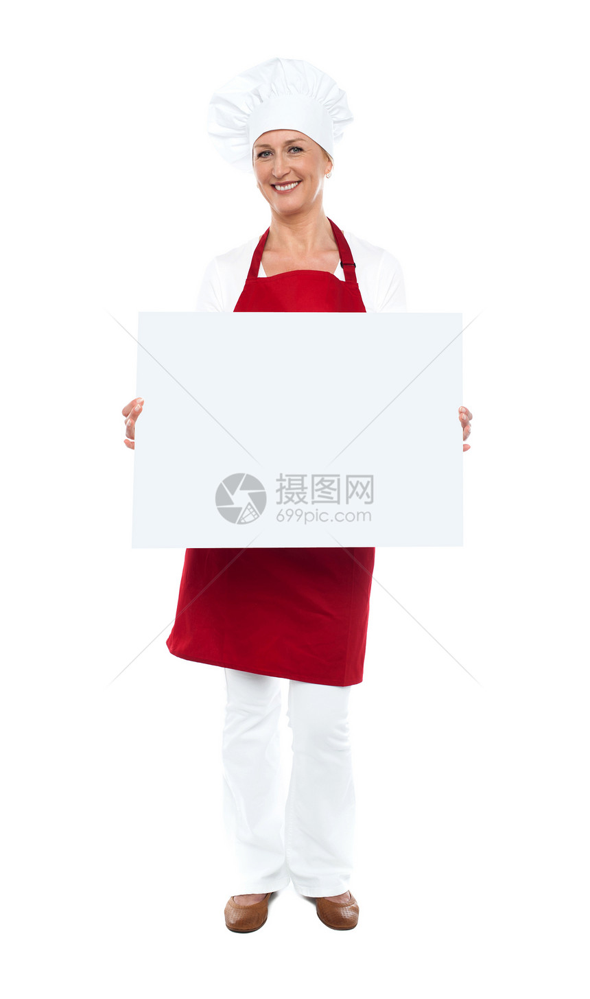 展示空白白广告板的女厨师女性餐厅冒充中年广告牌职业女士工作服务围裙图片