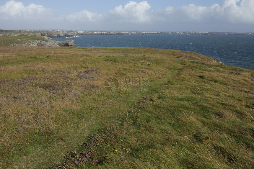 威尔士海岸道路天空游客蓝色悬崖植物风景绿色环境小路土地图片