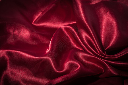 红色丝织纺织品背景涟漪投标奢华纺织品丝绸衣服窗帘热情亚麻折叠背景图片
