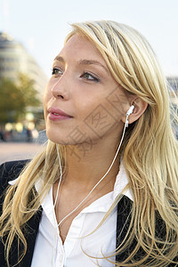 女商务人士戴耳听器商务女性商业金发人士成人背景图片