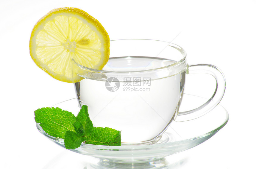 茶杯中的茶叶子杯子柠檬橙子植物餐具草本植物水果盘子食物图片