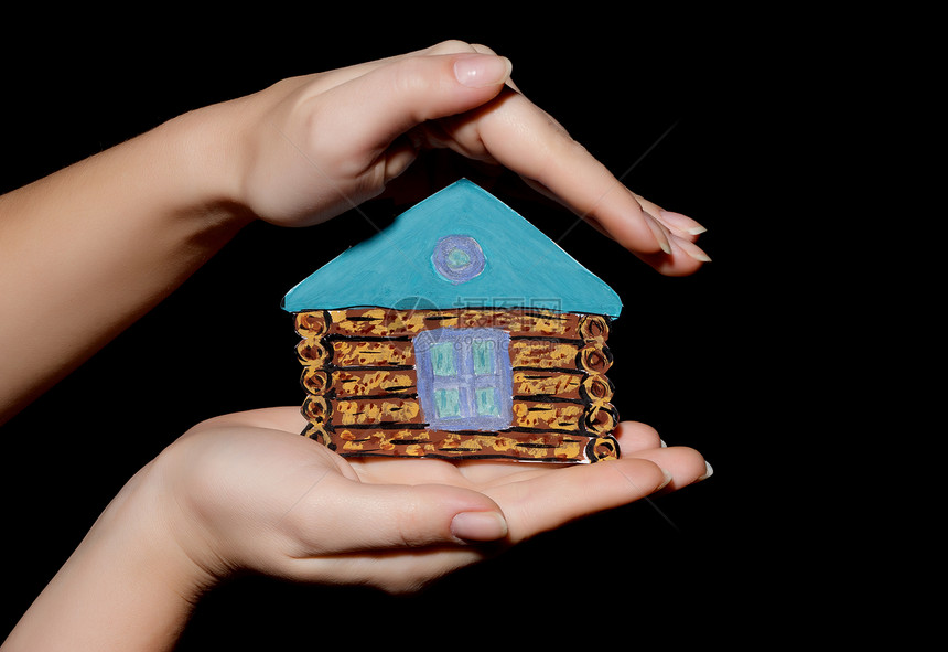 手拿着漆着房屋的油漆建筑住宅窗户绘画出租概念储蓄投资棕榈房子图片