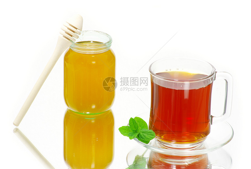 茶茶杯绿色一杯茶叶子棕色玻璃红色橙子液体白色概念图片