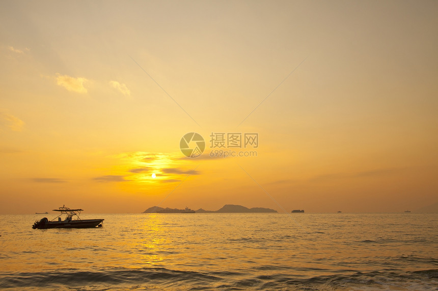 香港大海的日落海滩太阳旅行天空海浪海岸岩石反射支撑天气图片