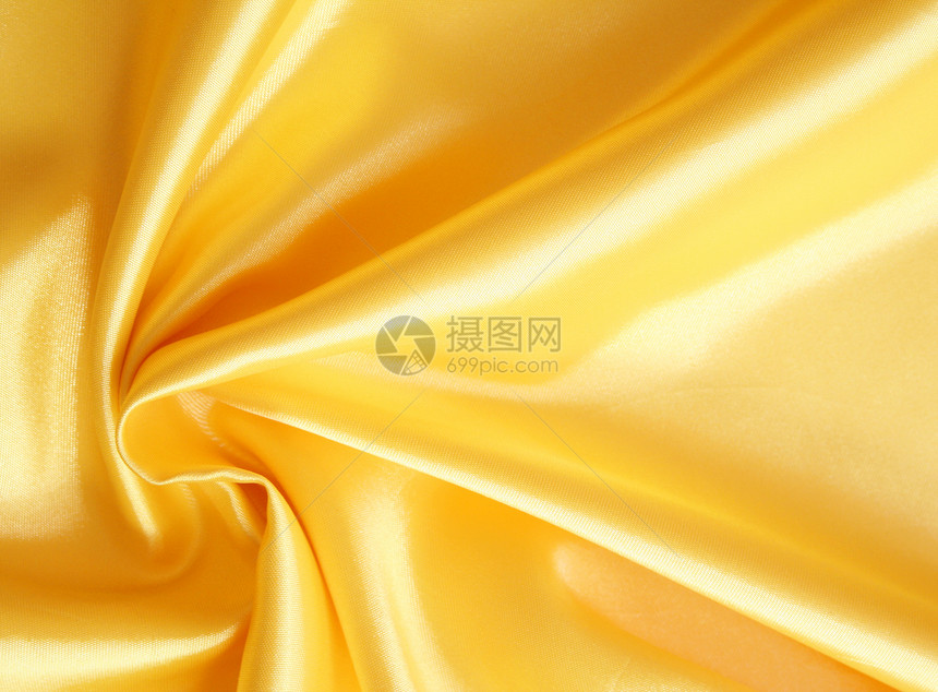 平滑优雅的金金丝绸投标海浪黄色材料织物丝绸涟漪曲线纺织品折痕图片