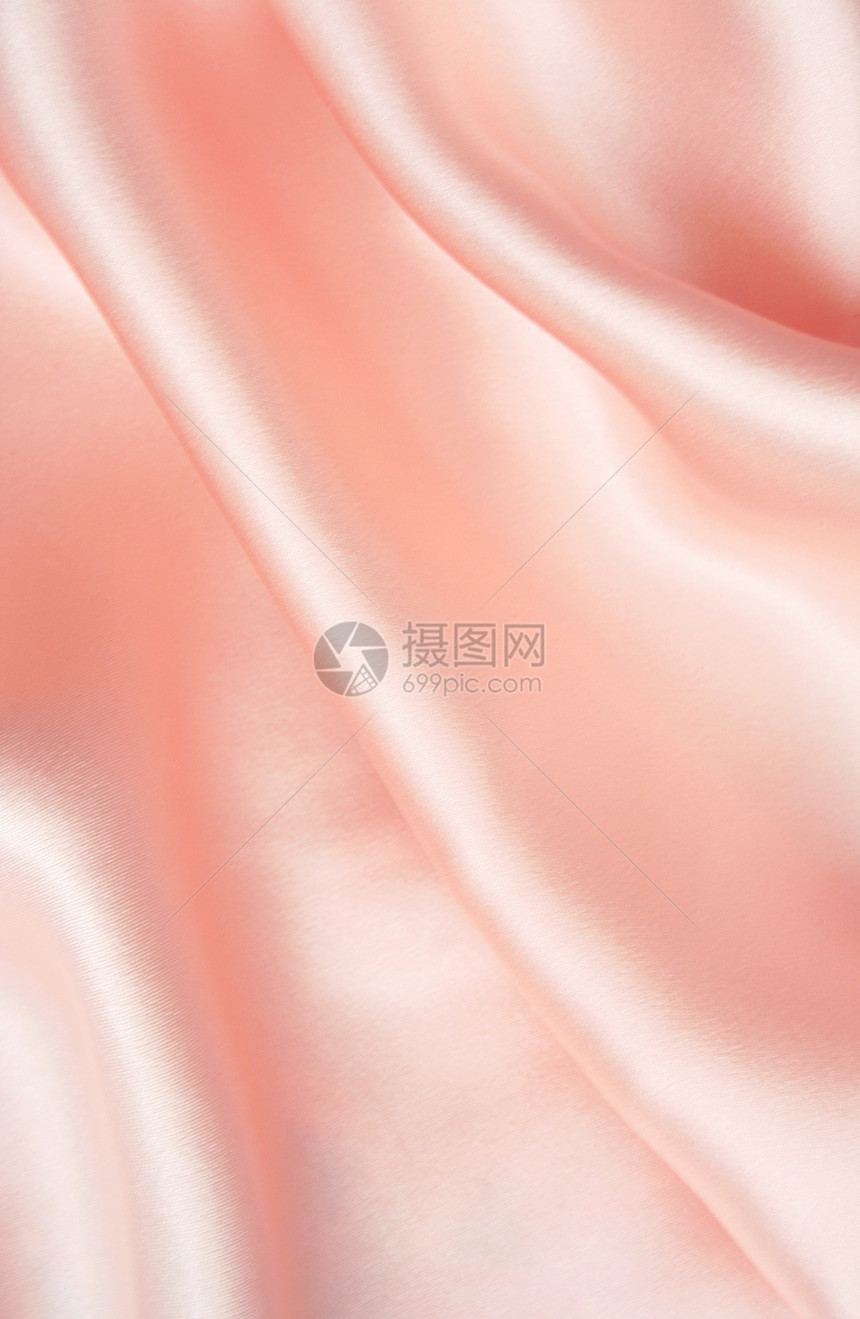 作为婚礼背景的优美粉色丝绸风格涟漪装饰艺术折痕材料玫瑰纺织品生产布料图片