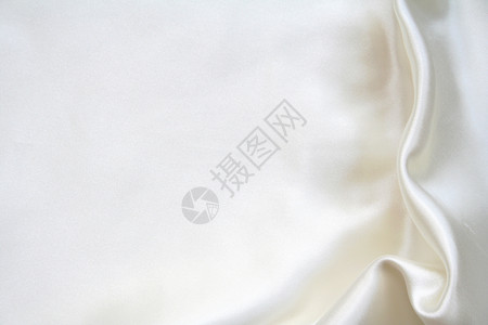 平滑优雅的白色丝绸可用作背景奢华折痕寝具婚礼版税衣服涟漪新娘投标织物背景图片