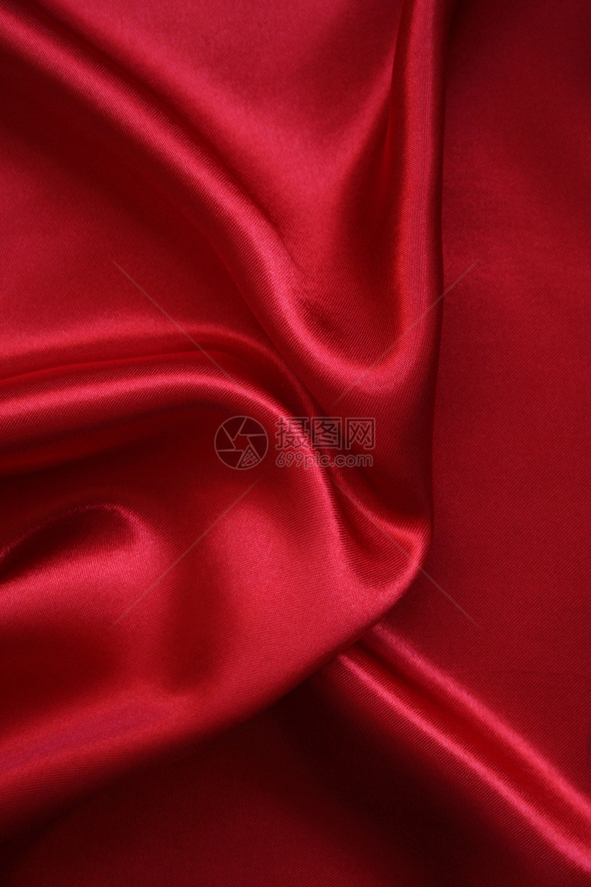 平滑的红丝绸背景窗帘纺织品投标胭脂柔软度曲线材料红色热情织物图片