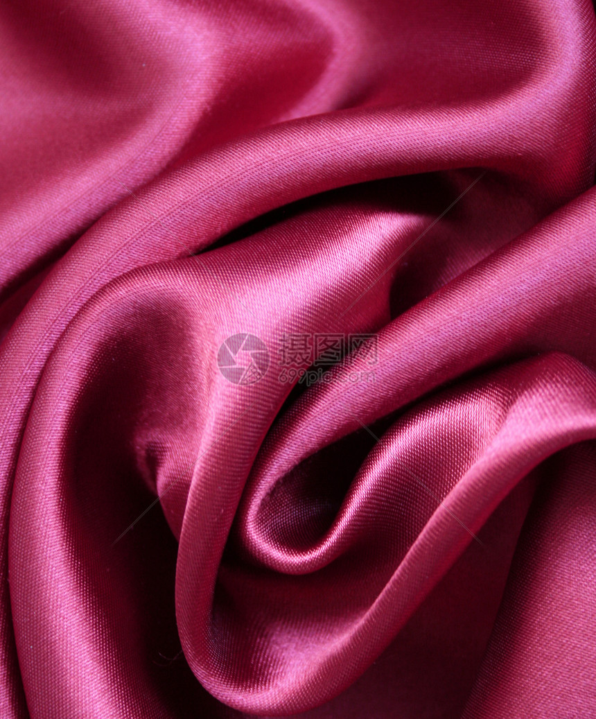 作为婚礼背景的优美粉色丝绸涟漪风格材料版税投标海浪生产布料折痕织物图片