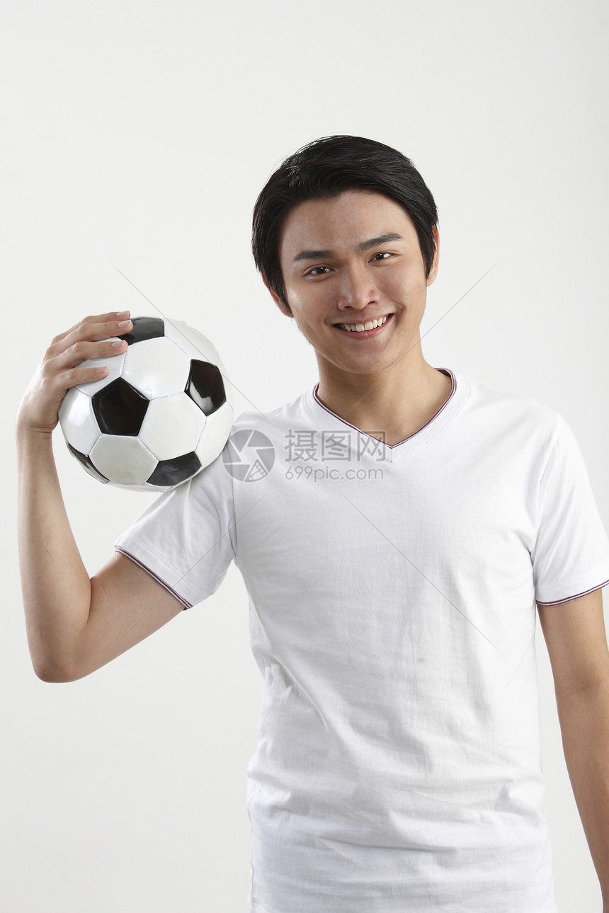 足球运动员黑发游戏长度微笑摄影锻炼手臂头发服装影棚图片