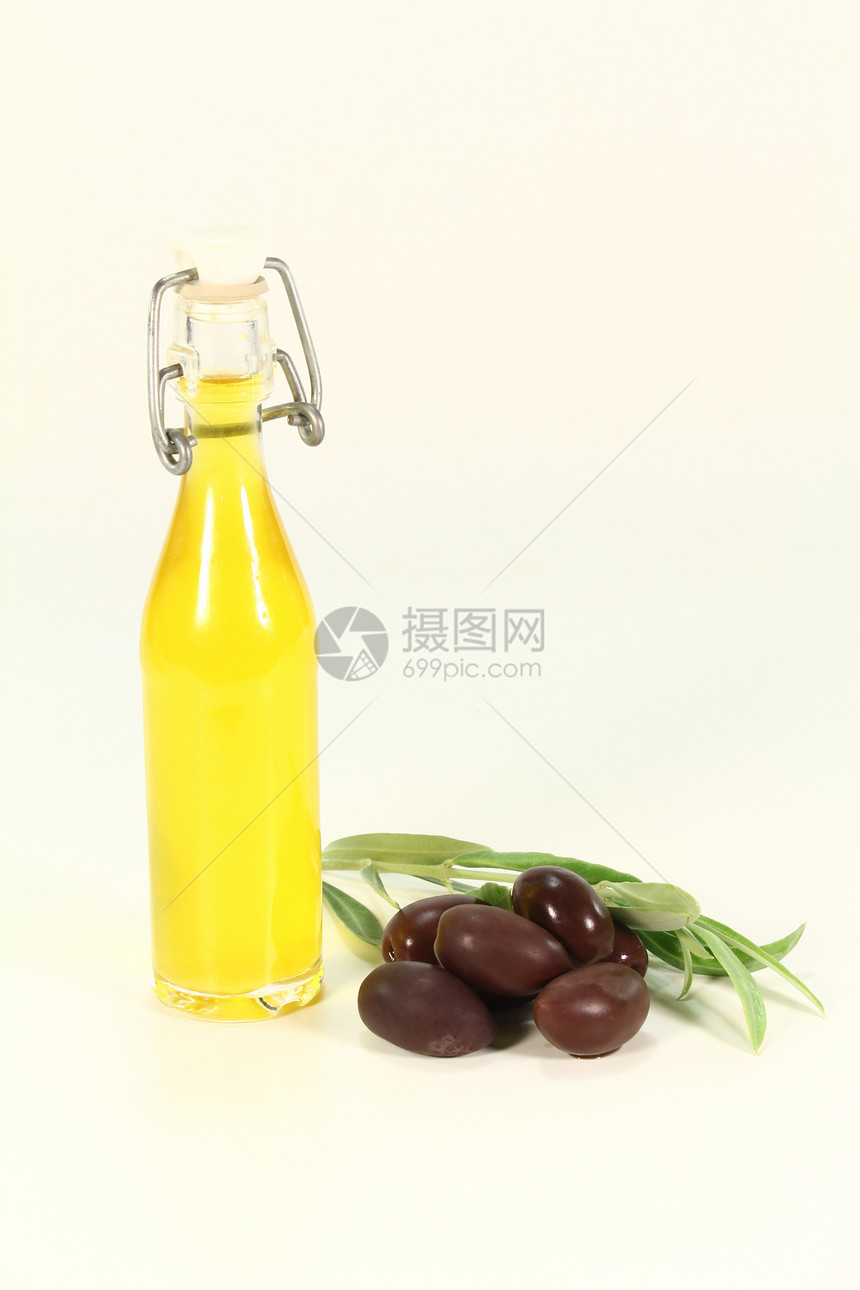 橄榄油产物橄榄枝冷压金黄色美食家油瓶食物绿色图片