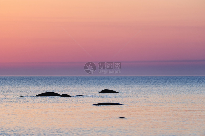 上午早早海岸岩石天空海洋环境悬崖日落石头支撑太阳图片