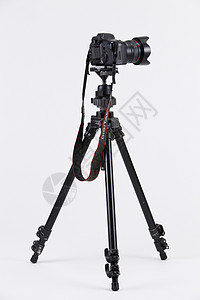配有三脚架相机的照相机题材单反照片镜片三脚架专业黑色职业摄影背景图片