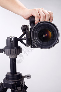 配有三脚架相机的照相机黑色三脚架职业专业摄影照片题材镜片单反背景图片
