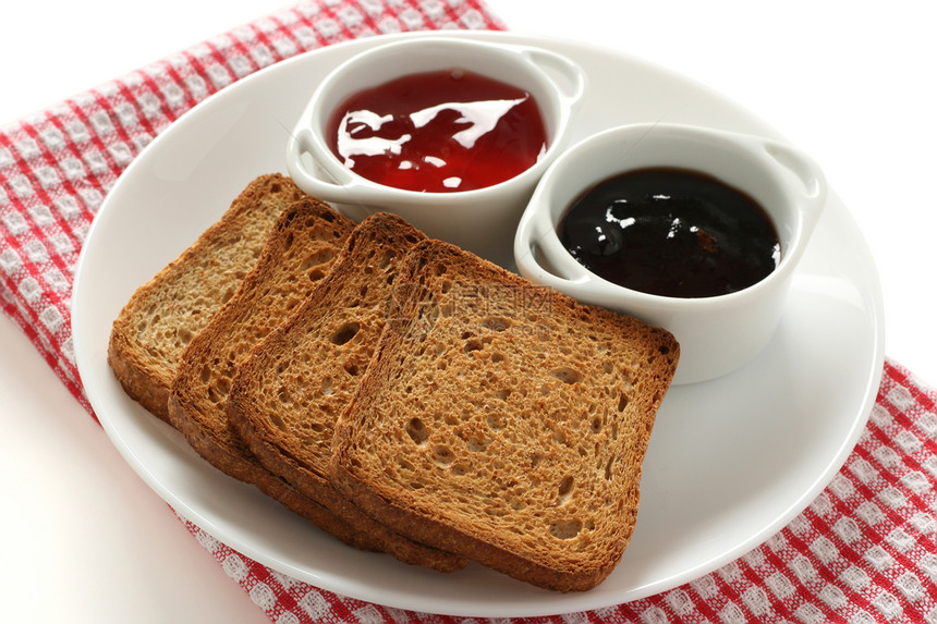 碗中加果酱的吐司白色饼干小吃甜点早餐面包食物红色盘子图片