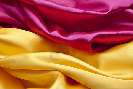 粉色和黄色的丝绸背景背景图片