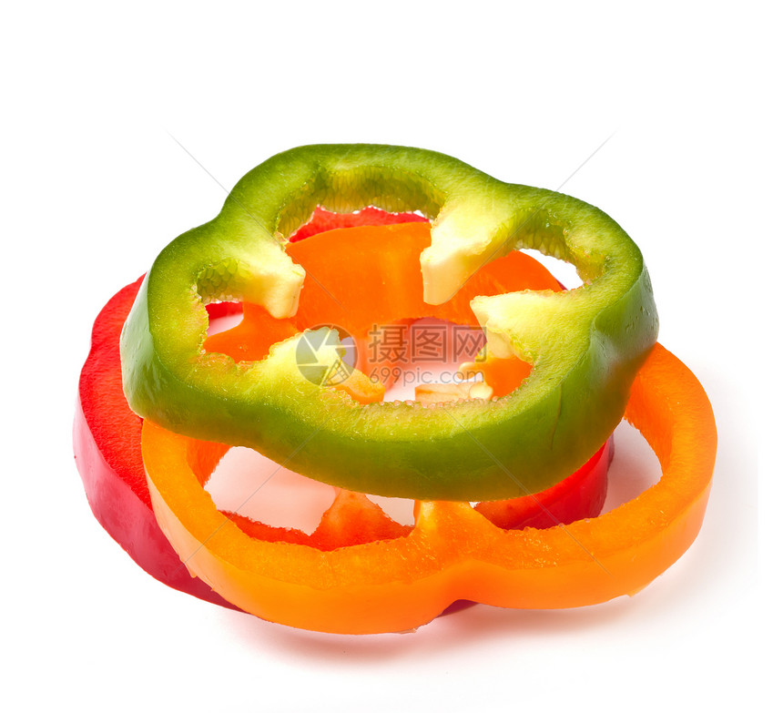 白色背景的橙绿色和红辣椒片蔬菜营养香料橙子辣椒食物红色图片