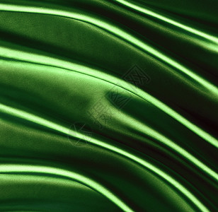 深绿色丝绸的纹理背景图片